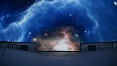 Noční obloha plná hvězd a vesmírných mlhovin nad observatoří